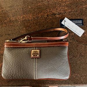 Dooney& Burke large slim wristlet. NWT